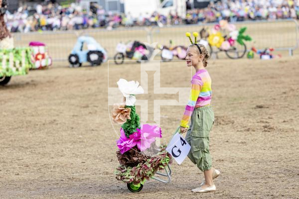 Picture by Sophie Rabey.  21-08-25.  North Show 2025 - Battle of Flowers.
Class G - Decorated Wheelbarrow, any flowers, any age, adult/child.
G4 - Dot - Flower Pot Girls : Mollie Boatwright-Smith