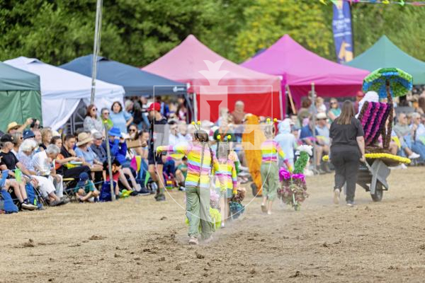 Picture by Sophie Rabey.  21-08-25.  North Show 2025 - Battle of Flowers.
Class G - Decorated Wheelbarrow, any flowers, any age, adult/child.
G6 - Dot - Flower Pot Girls : Poppy Troalic