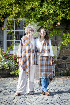 Picture by Peter Frankland. 26-08-25 Katy Barrett has designed a Guernsey Tartan which is inspired by typical local things like cows, donkeys and the Guernsey flag. The launch was at Saumarz Park Folk Museum. Pictured with Elainer Laine.