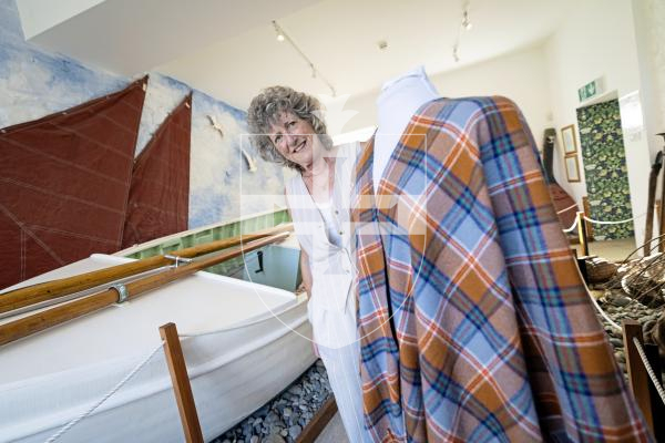 Picture by Peter Frankland. 26-08-25 Katy Barrett has designed a Guernsey Tartan which is inspired by typical local things like cows, donkeys and the Guernsey flag. The launch was at Saumarz Park Folk Museum.