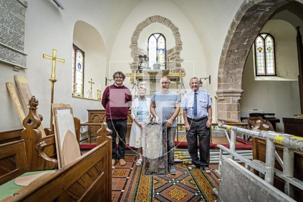 Picture by Peter Frankland. 27-08-25 A stained glass window at Forest Church has been removed, restored and is now being reinstalled in place. L-R - Rev Adrian Datta, Nancy Smith (member of the church), Peter Vivian (Guernsey Glass Craft) and Keith Bienvenu, (People's Churchwarden).