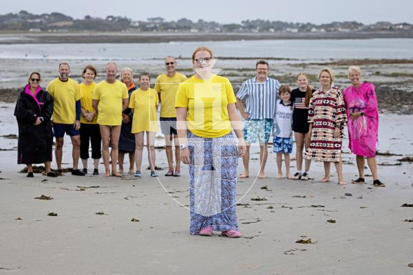 Picture by Peter Frankland. 27-08-25 Alice MIller has been swiiming every day for 100 days to raise money for the Guernsey Conservation Volunteers. Today was her last day and she was joined at Vazon by members of her family, friends and some of the GCV team.