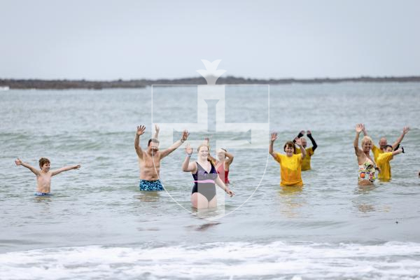Picture by Peter Frankland. 27-08-25 Alice MIller has been swiiming every day for 100 days to raise money for the Guernsey Conservation Volunteers. Today was her last day and she was joined at Vazon by members of her family, friends and some of the GCV team.