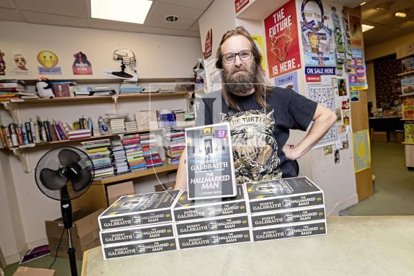 Picture by Sophie Rabey.  01-09-25.  The new J. K. Rowling book, The Hallmarked Man, is out in bookstores tomorrow.  Matt Jehan from the Lexicon in St Peter Port is pictured with some their stock.  The book contains chapters with reference to Sark Island.
