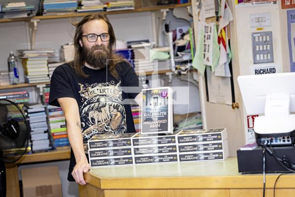 Picture by Sophie Rabey.  01-09-25.  The new J. K. Rowling book, The Hallmarked Man, is out in bookstores tomorrow.  Matt Jehan from the Lexicon in St Peter Port is pictured with some their stock.  The book contains chapters with reference to Sark Island.