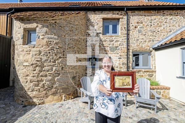 Picture by Sophie Rabey.  02-09-25.  Ken and Wendi Overby are over visiting Guernsey from the US and trying to trace back Wendi's family history.  Her family used to live at Les Galliennes in Talbot Valley, the lovely farmhouse belonging to Darren Etasse and his family.  They had a tour around the premises today.
