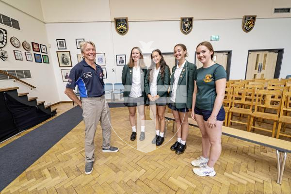 Picture by Sophie Rabey.  09-09-25.  Ahead of Guernsey Air Display tomorrow, some of the pilots visited local schools to give presentations to students.  Rich Goodwin, who flys the Jet Pitts, gave a talk to The Ladies College.
Students L-R Poppy Robison, Lottie Colmer, Lily Hurrell and Holly Lavin (all 14 years old) asked Rich Goodwin some questions about his life as a pilot.