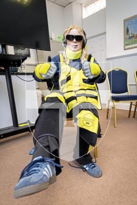 Picture by Sophie Rabey.  09-09-25.  A demonstration of the new Dementia Suits at Guernsey Alzheimer's Assocation.  
Guernsey Alzheimer's are introducing the suits conjunction with the Admiral Nurses to raise awareness of the physical challenges that people with dementia and old age might face in day to day tasks.  
GP reporter Erin Vaudin tries on the dementia suit.