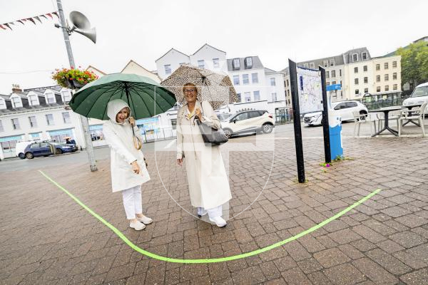 Picture by Sophie Rabey.  10-09-25.  Guernsey Arts have installed a Green Line across St Peter Port pavements as a self-guided walk through Guernsey's historic town.
L-R Ann Kilkenny from Australia and Lisa Lee, originally from Guernsey but now lives in France, standing by the new Green Line.