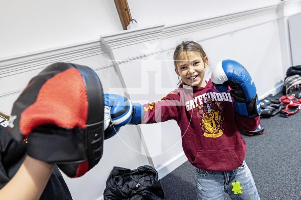 Picture by Sophie Rabey.  22-11-25.  Sport in the Library returns for the third year.  Guille-Alles Library and Guernsey Sports Commission teamed up to give the public the opportunity to try a range of sports for free.
Libby Willcocks (8) trying boxing for the first time.