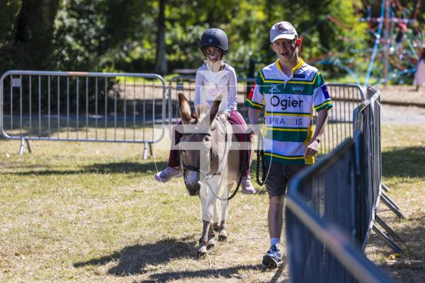 Picture by Peter Frankland. 22-08-26 Lions Club of Guernsey Donkey Derby 2026 at Saumarez Park. Pari Koonjobeeharry, 7 having a donkey ride. Led by Ifan Tudur.