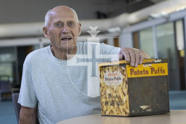 Picture by Peter Frankland. 01-09-26 Frank Marquis has found an old Walters Potato Puffs tin in his loft. It dates back to the 1940s.