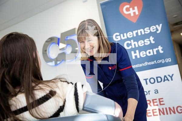 Picture by Peter Frankland. 19-01-24 Chest and Heart are doing health checks on employees of businesses at Admiral Park as part of a wider initiative for people using Admiral Park Plaza. Debbie Pittman of Guernsey Chest and Heart takes an employee's blood pressure.