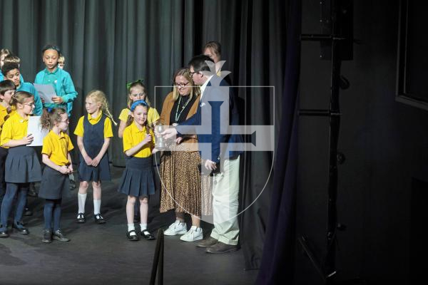 Picture by Peter Frankland. 17-03-25 Eisteddfod 2025 class 060 Group Speaking Under 9. With adjudicator Ben Humpfrey. Presentation of cup to winner - St Martin's School.