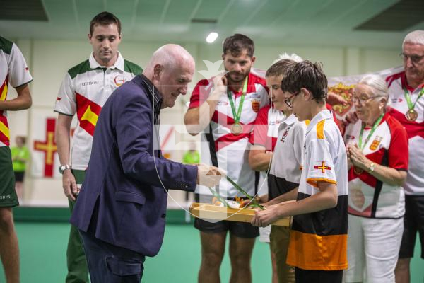 Picture by Luke Le Prevost. 13-07-23.
Island Games 2023 - Bowls at Hougue du Pommier. Medal Ceremony. Open Pairs Final. Deputy Peter Ferbrache awards the medals