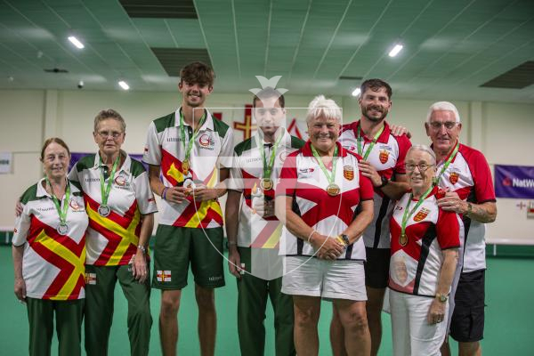 Picture by Luke Le Prevost. 13-07-23.
Island Games 2023 - Bowls at Hougue du Pommier. Medal Ceremony. Open Pairs Final. L-R Silver medalists Rosemary Ogier and Shirley Petit, gold medalists Bradley Le Noury and Joshua Bonsall and bronze medalists Luke Le Sueur, Sally Black, Jean Holmes and Cyril Renouf
