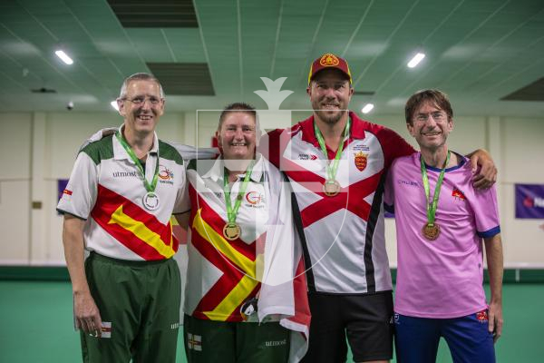 Picture by Luke Le Prevost. 13-07-23.
Island Games 2023 - Bowls at Hougue du Pommier. Medal Ceremony. Open Singles Final. L-R Silver medalist Ian Merrien, gold medalist Alison Merrien, bronze medalists Luke Le Sueur and David Leach