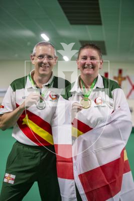 Picture by Luke Le Prevost. 13-07-23.
Island Games 2023 - Bowls at Hougue du Pommier. Medal Ceremony. Open Singles Final. L-R Silver medalist Ian Merrien and gold medalist Alison Merrien