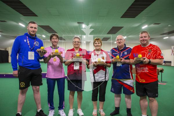 Picture by Luke Le Prevost. 13-07-23.
Island Games 2023 - Bowls at Hougue du Pommier. Medal Ceremony. Presentation of Island Games mementos to island representatives. L-R James Macleod (Western Isles), David Leach (Bermuda), Adrienne Edwards (Ynys Mon), Ann Cross (Jersey), Terry Summers (Falkland Islands) and Barrie Bruce (Orkney)