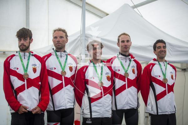 Picture by Luke Le Prevost. 14-07-23.
Island Games 2023 - Cycling Criterium Medal Ceremony at Crown Pier. Men's team. Bronze medalists Jersey