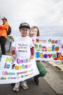 Picture by Luke Le Prevost. 13-07-23.
Island Games 2023 - Half Marathon along Town Seafront. Men's Race. L-R Steve Dawes nephew Tyler Whitty (5) and his mum Natalie Whitty showed their support