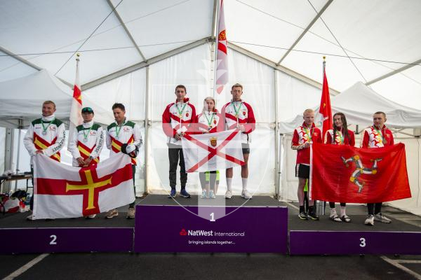 Picture by Luke Le Prevost. 14-07-23.
Island Games 2023 - Triathlon Relay Medal Ceremony at Crown Pier. L-R Silver medalists Guernsey, gold medalists Jersey and bronze medalists Isle of Man