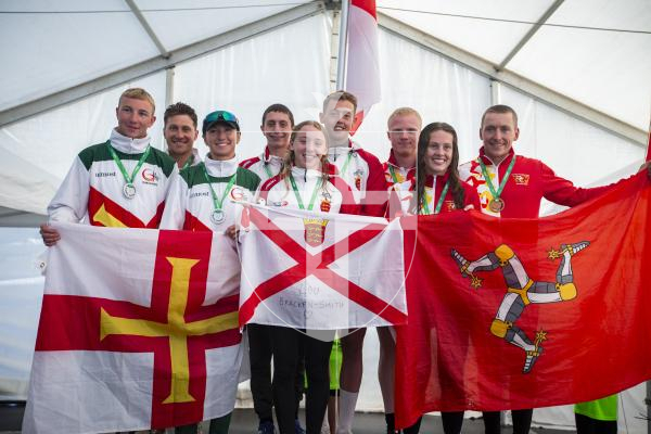 Picture by Luke Le Prevost. 14-07-23.
Island Games 2023 - Triathlon Relay Medal Ceremony at Crown Pier. L-R Silver medalists Guernsey, gold medalists Jersey and bronze medalists Isle of Man