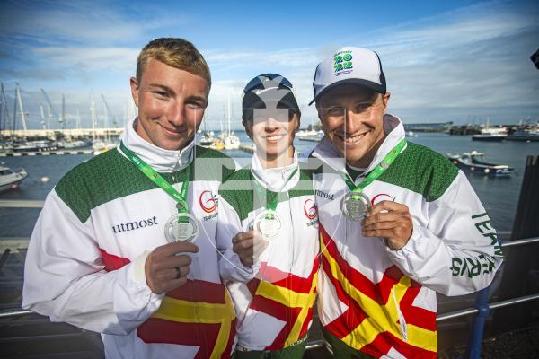 Picture by Luke Le Prevost. 14-07-23.
Island Games 2023 - Triathlon Relay Medal Ceremony at Crown Pier. Silver medalists Guernsey L-R Thierry Le Cheminant, Megan Chapple and Joshua Lewis