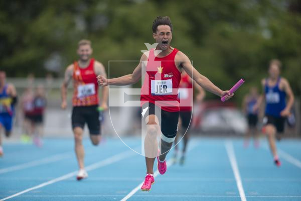 Picture By Peter Frankland. 14-07-23 Guernsey International Island Games 2023. Footes Lane - Athletics. Jersey's Steven Mackay celebrates in the 4x100m relay.