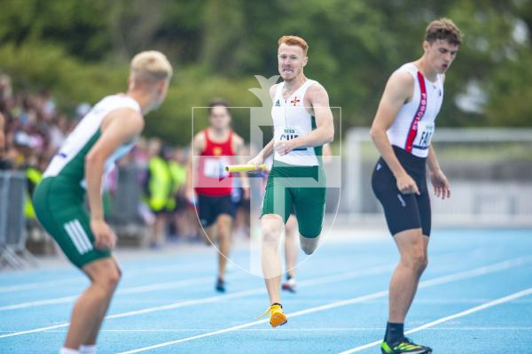 Picture By Peter Frankland. 14-07-23 Guernsey International Island Games 2023. Footes Lane - Athletics. Josh Duke waits to take over from Alastair Chalmers in the 4x400m relay.