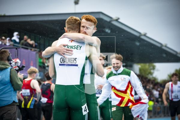 Picture By Peter Frankland. 14-07-23 Guernsey International Island Games 2023. Footes Lane - Athletics. Chalmers bros embrace at the end of the 4x400m relay.