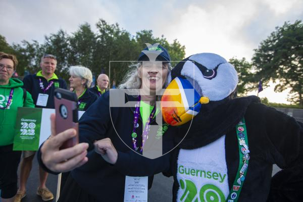 Picture By Peter Frankland. 14-07-23 Guernsey International Island Games 2023. Closing Ceremony at Footes Lane. Karen Marshall grabs a selfie with Jet The Puffin.