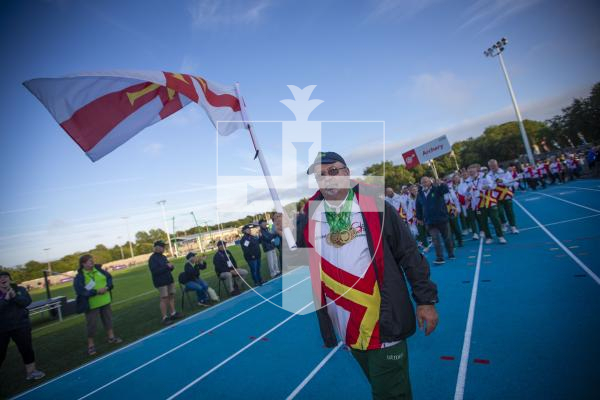 Picture By Peter Frankland. 14-07-23 Guernsey International Island Games 2023. Closing Ceremony at Footes Lane. Andy Torode was the flag bearer.
