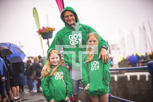 Picture by Sophie Rabey.  14-07-23.  
Guernsey 2023 NatWest International Island Games - Go Guernsey clothing has been sold during the week.  Steve Le Flem with his daughters L-R Isabella (7) and Emilia (9).  The girls have had their tops signed by athletes during the week.