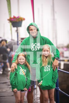 Picture by Sophie Rabey.  14-07-23.  
Guernsey 2023 NatWest International Island Games - Go Guernsey clothing has been sold during the week.  Steve Le Flem with his daughters L-R Isabella (7) and Emilia (9).  The girls have had their tops signed by athletes during the week.