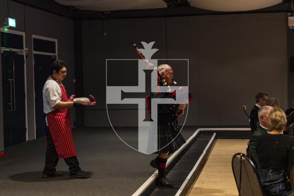 Picture by Sophie Rabey.  31-01-26.  Guernsey's Scottish Association held the Burns Night celebrations at Beau Sejour, sponsored by Titan Wealth.  The Haggis was piped in by Chris Bradshaw (piper) and carried by Mikee Bataller (chef).