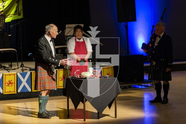 Picture by Sophie Rabey.  31-01-26.  Guernsey's Scottish Association held the Burns Night celebrations at Beau Sejour, sponsored by Titan Wealth.  The Haggis was piped in by Chris Bradshaw (piper) and carried by Mikee Bataller (chef).
Stuart Hardie (Past President of the GSA) doing the Address to the Haggis, followed by the drinking of whiskey.