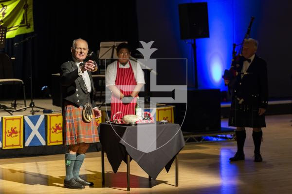 Picture by Sophie Rabey.  31-01-26.  Guernsey's Scottish Association held the Burns Night celebrations at Beau Sejour, sponsored by Titan Wealth.  The Haggis was piped in by Chris Bradshaw (piper) and carried by Mikee Bataller (chef).
Stuart Hardie (Past President of the GSA) doing the Address to the Haggis, followed by the drinking of whiskey.