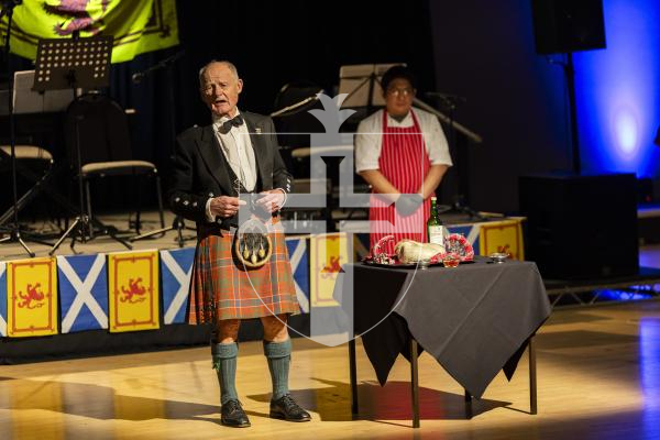 Picture by Sophie Rabey.  31-01-26.  Guernsey's Scottish Association held the Burns Night celebrations at Beau Sejour, sponsored by Titan Wealth.  The Haggis was piped in by Chris Bradshaw (piper) and carried by Mikee Bataller (chef).
Stuart Hardie (Past President of the GSA) doing the Address to the Haggis, followed by the drinking of whiskey.