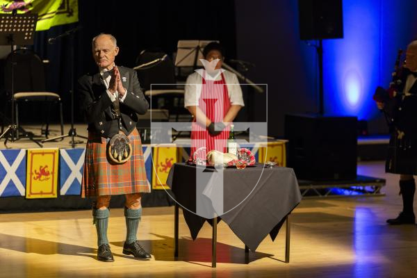 Picture by Sophie Rabey.  31-01-26.  Guernsey's Scottish Association held the Burns Night celebrations at Beau Sejour, sponsored by Titan Wealth.  The Haggis was piped in by Chris Bradshaw (piper) and carried by Mikee Bataller (chef).
Stuart Hardie (Past President of the GSA) doing the Address to the Haggis, followed by the drinking of whiskey.