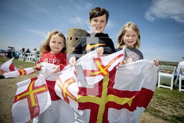 Picture by Peter Frankland. 09-05-24 Liberation Day 2024. Castel parish event. L-R - Aoibeh O'Neil, 4, Connor O'Neil, 8 and Lauren O'Neil, 6 were looking forward to watching the cavalcade pass.