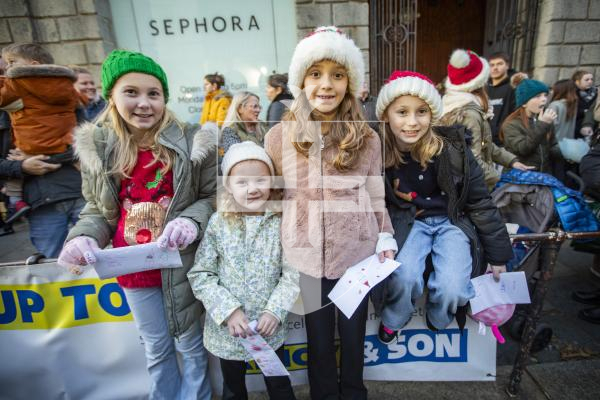 Picture by Sophie Rabey.  25-11-23.  Father Christmas comes to St Peter Port town to switch on the Christmas lights 2023.
L-R Grace Thomson (10), Lailee Loveridge (5), Ellena Loveridge (8) and Arabella Thomson (8).