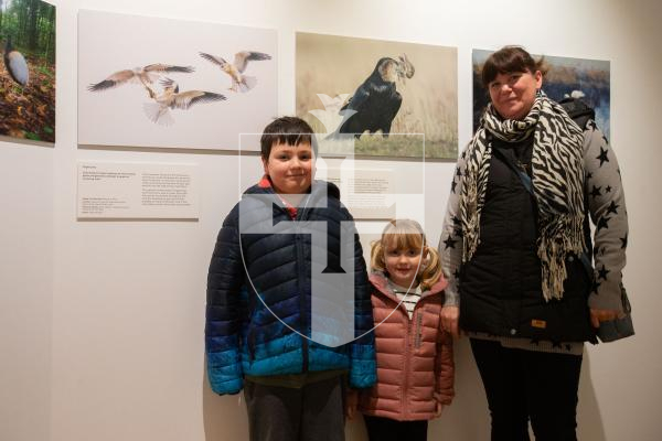 Picture by Tom Videlo. 27-01-24 Ryan Van Vliet, 8, and his 4-year-old sister Caitlin visiting the annual WIldlife Photographer of the Year exhibition at Candie with their mum Lizzie.