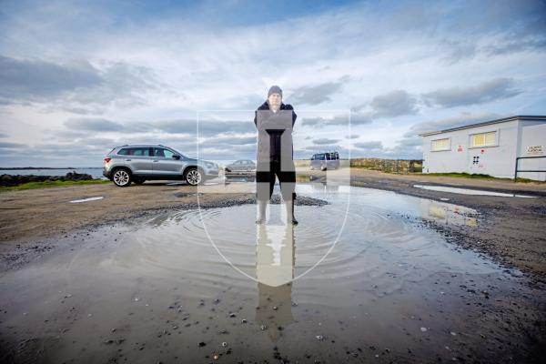 Picture by Peter Frankland. 30-01-24 Retired police officer Ray Sebire is concerned about the state of the coastal car parks, many of which have large potholes and puddles.
Photographed here at Les Amarreurs car park.