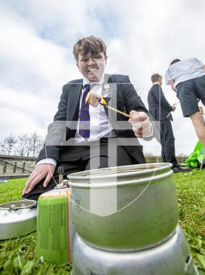 Picture by Peter Frankland. 31-01-24 St. Sampson's High School are running extra-curricular activities for students during lunchtimes. Duke of Edinburgh Award Scheme. Theo Pattimore, 14 cooking 'Smores' (marshmallows which are then put between two chocolate biscuits).