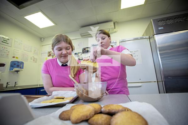 Picture by Peter Frankland. 31-01-24 St. Sampson's High School are running extra-curricular activities for students during lunchtimes. Cookery Club. L-R - Maisie Harris, 14 and Rosie McClean, 14 making cookies.
