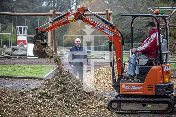 Picture by Peter Frankland. 01-02-24 Saumarez Park playground is being resurfaced with new woodchip donated by Special Branch tree surgeons. Damian Harris from Agriculture, Countryside and Land Management Services is overseeing the work. On the digger is Kevin Simon.