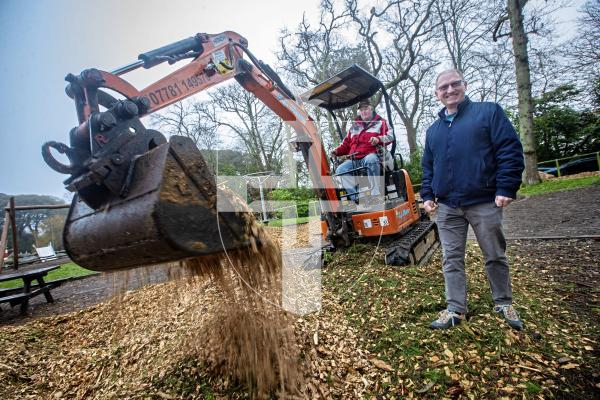 Picture by Peter Frankland. 01-02-24 Saumarez Park playground is being resurfaced with new woodchip donated by Special Branch tree surgeons. Damian Harris from Agriculture, Countryside and Land Management Services is overseeing the work. On the digger is Kevin Simon.