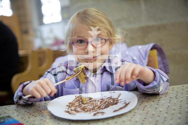 Picture by Peter Frankland. 13-02-24 Town Church - Cheshire Home fundraising pancake day event. Georgina Ensor, 5 was visiting the island with her mum from Wolverhampton. She is pictured finishing off her second pancake.
