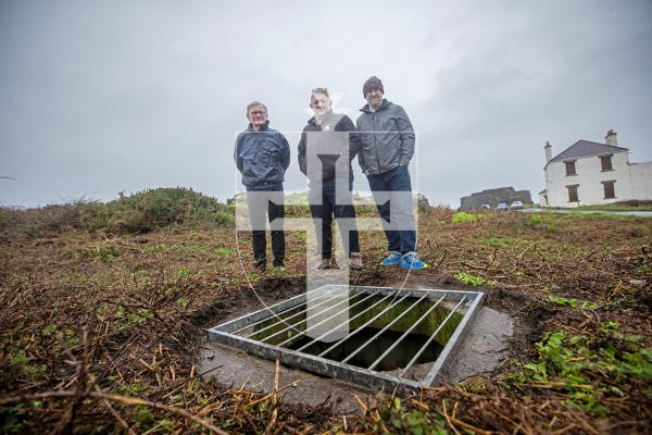 Picture by Peter Frankland. 20-02-24 L-R - Martin Joyce, Paul Bourgaize and Ben Drew of Festung Guernsey are hoping to be able to excavate some gun emplacements and bunkers at Fort Doyle after they were exposed by strimming activity. They have put temporary covers over the holes to make them safe.